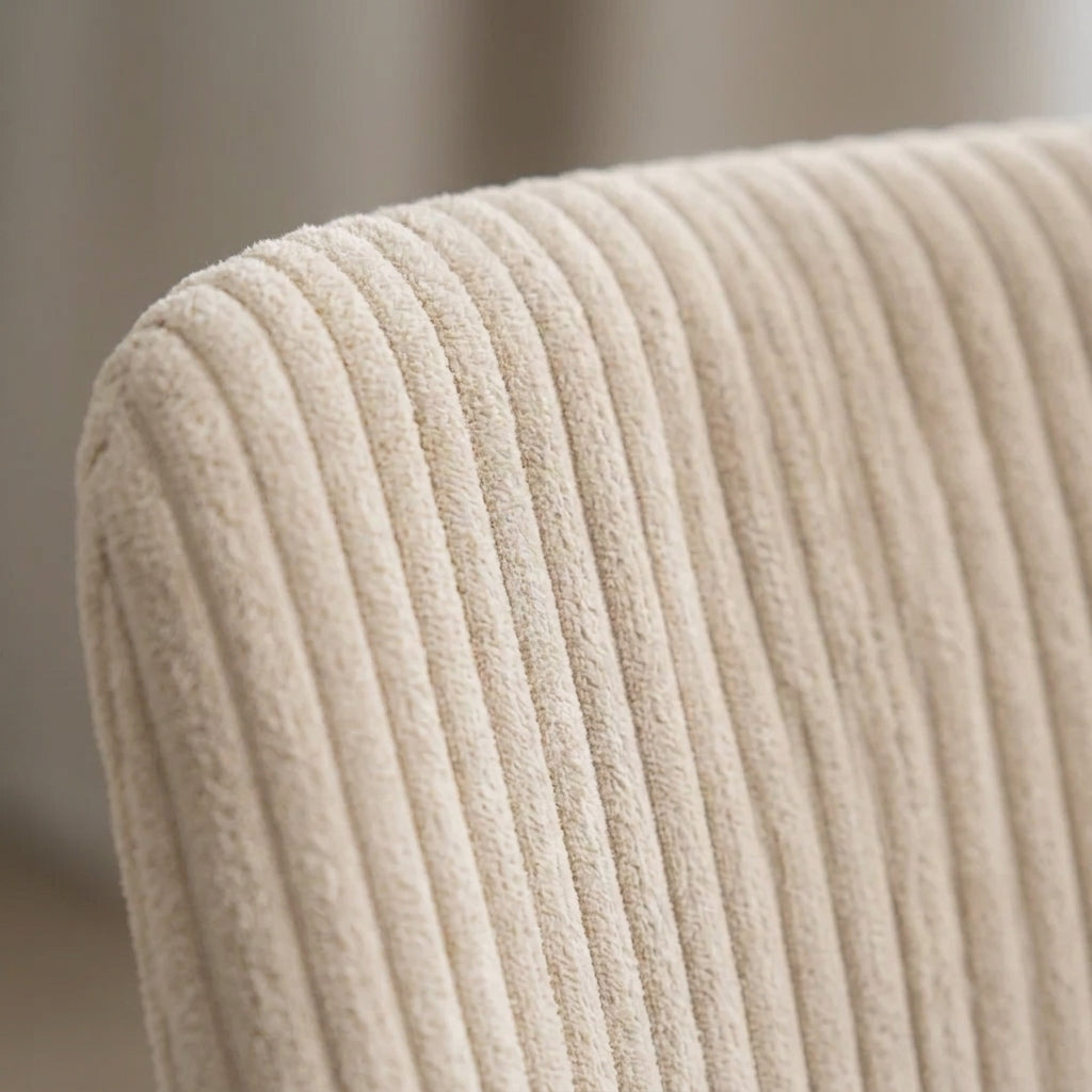 Close up of the cream corduroy ribbing on a Sloan dining chair back