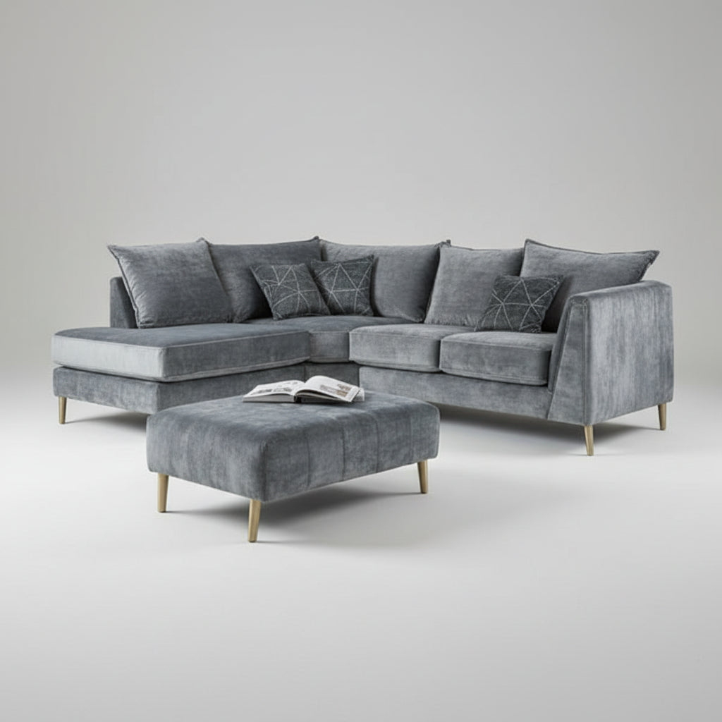 Gray sectional sofa with matching ottoman in a modern living room.