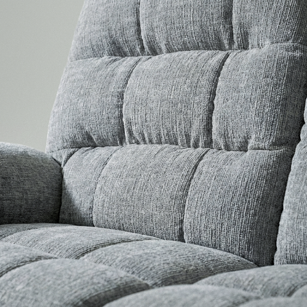 Close-up of the chunky grey chenille weave and deep pleated banding on the Cloud sofa