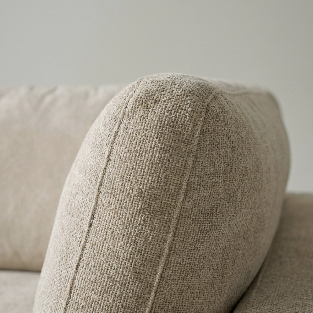 Close-up of the oatmeal weave on the rounded bolster arm of the New Haven sofa