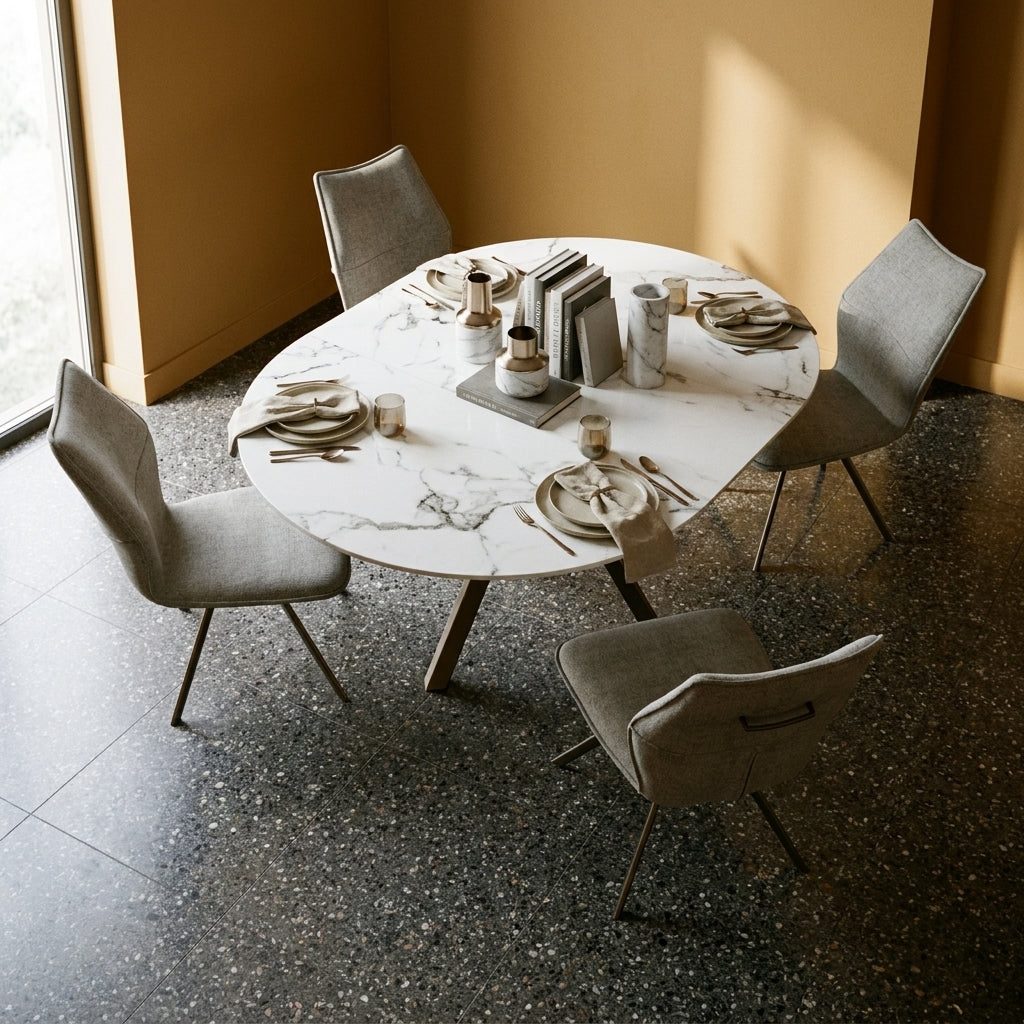 Porthos Round Extending Dining Set laid for lunch in a dining room with warm ochre walls and a dark terrazzo floor
