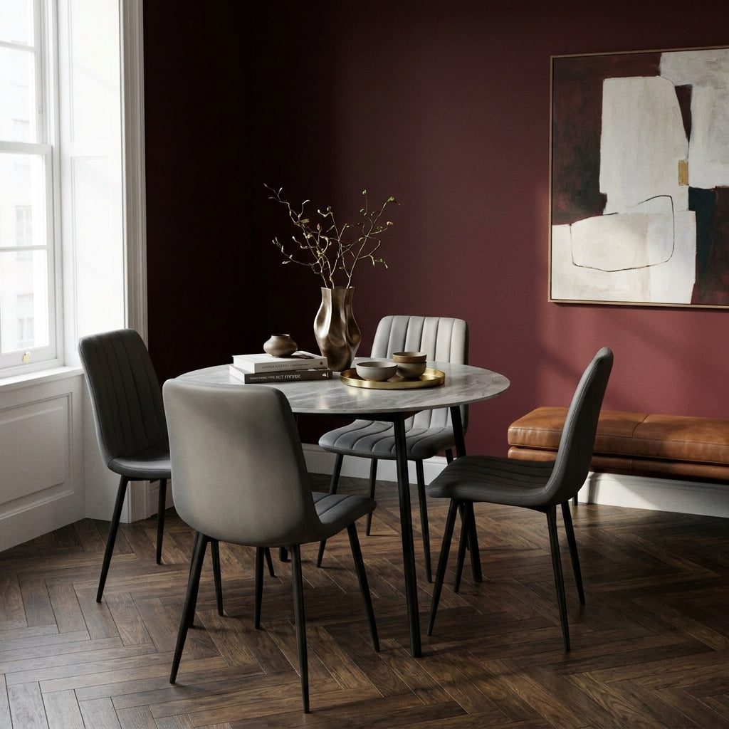 Sardinia 5 Piece Round Dining Set in the corner of a flat with deep burgundy walls and a herringbone parquet floor