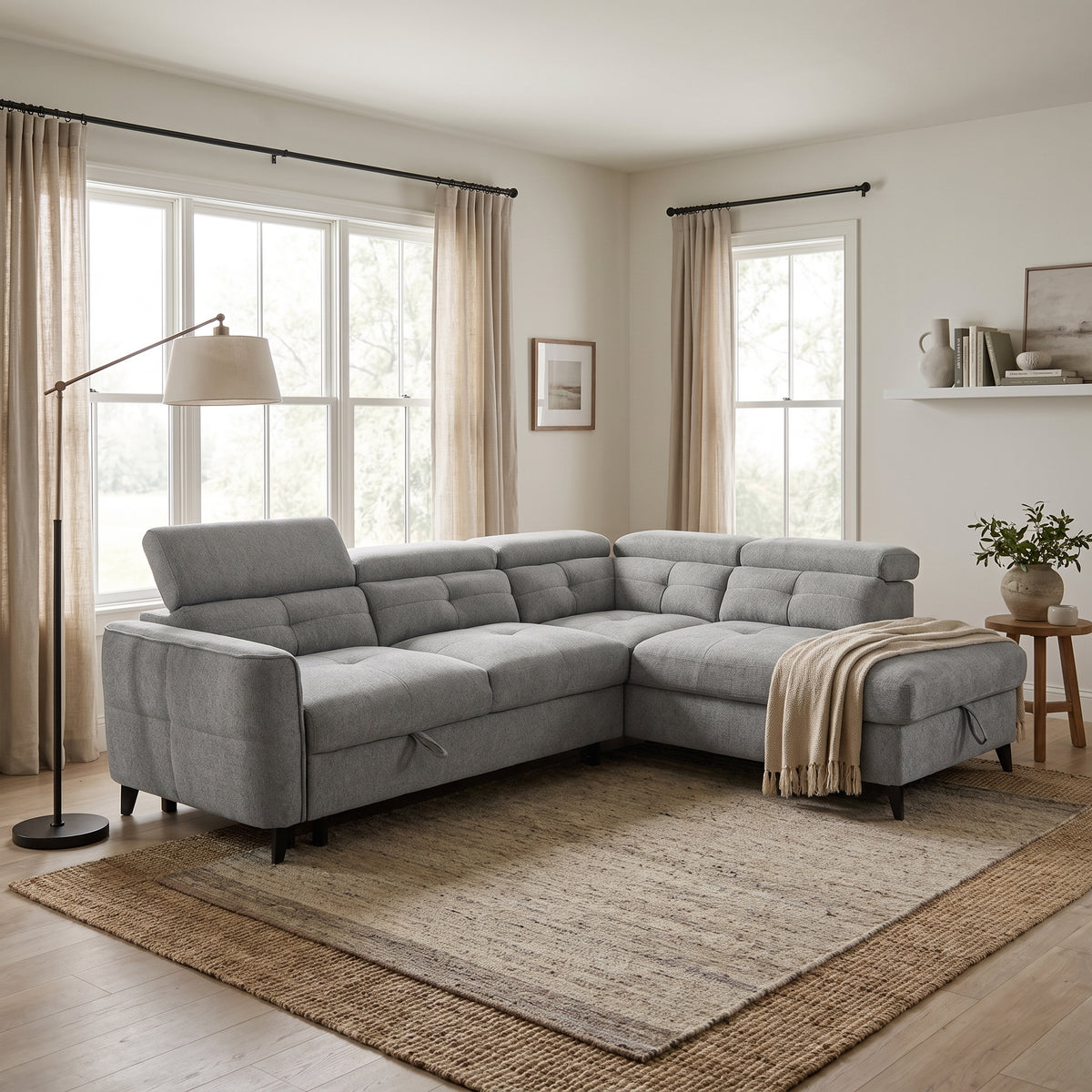 Nemo corner sofa bed with adjustable headrests in a bright Scandinavian room with white walls and a jute rug