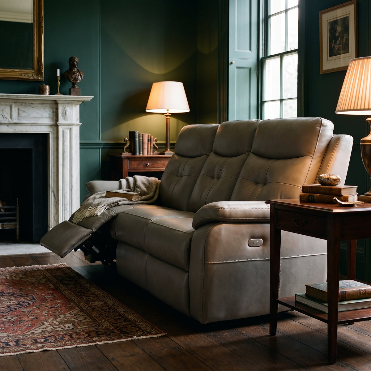 Grace recliner with one footrest extended in a period room with bottle green walls and a marble fireplace