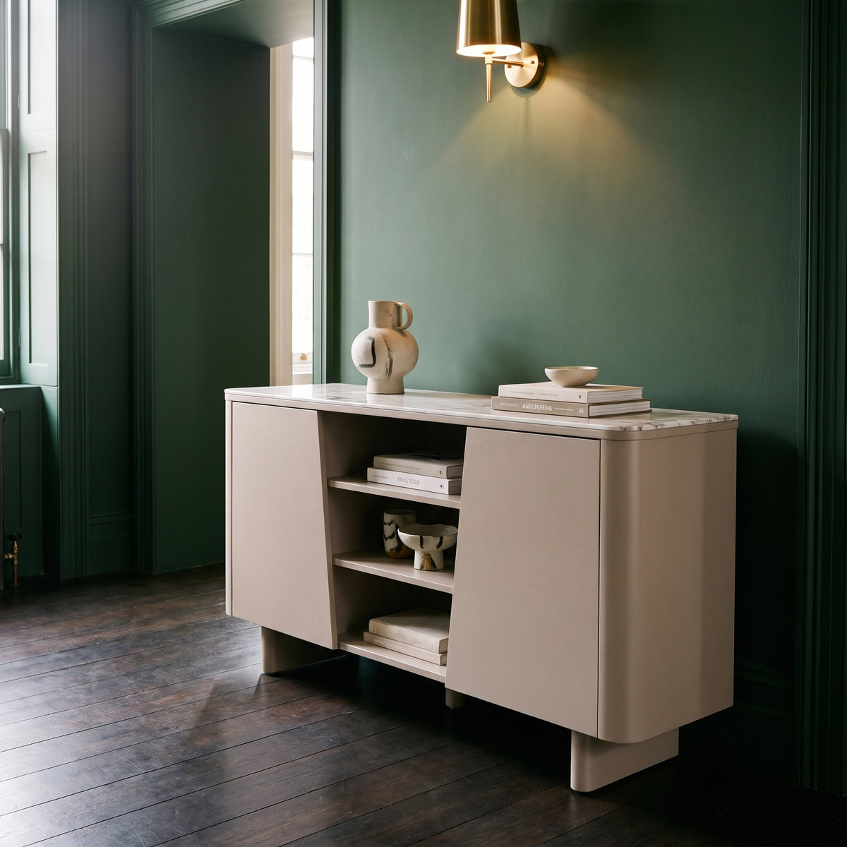Castello sideboard in a hallway with deep forest green walls and dark stained floorboards