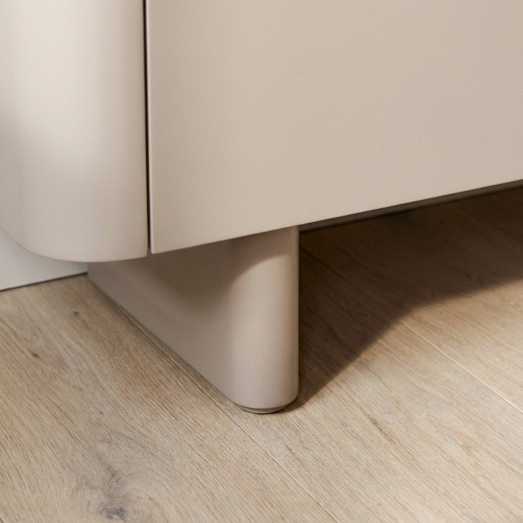 Close up of the short cylindrical taupe leg and matt lacquer finish on the Castello sideboard