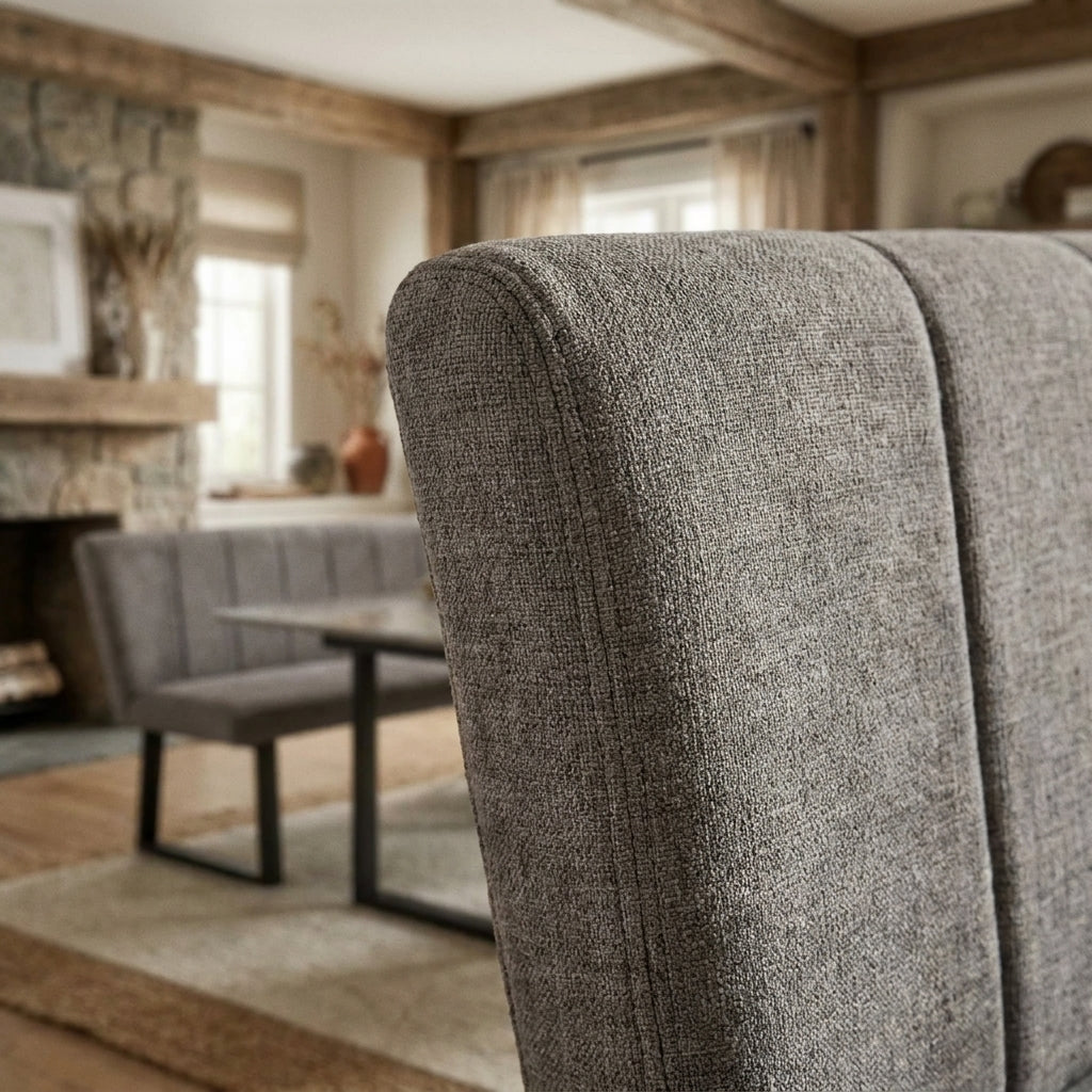 Close up of the ribbed grey fabric and stitched seam on the Olivia corner bench