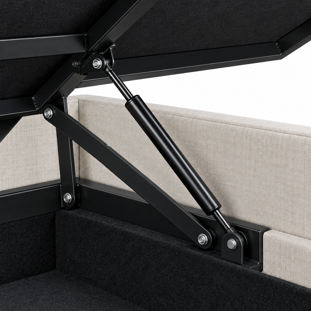 Close-up of the Kratos ottoman bedframe lifting mechanism, showing the black gas strut and hinge linkage against the oatmeal linen base and lined storage well