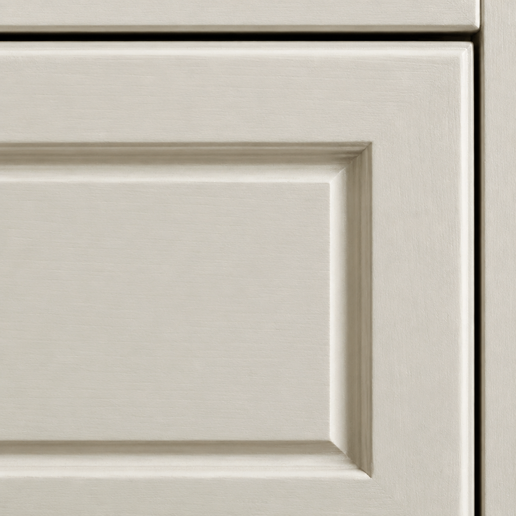 Close-up of an Aurora bedside drawer front showing the recessed shaker panel in a cream painted finish