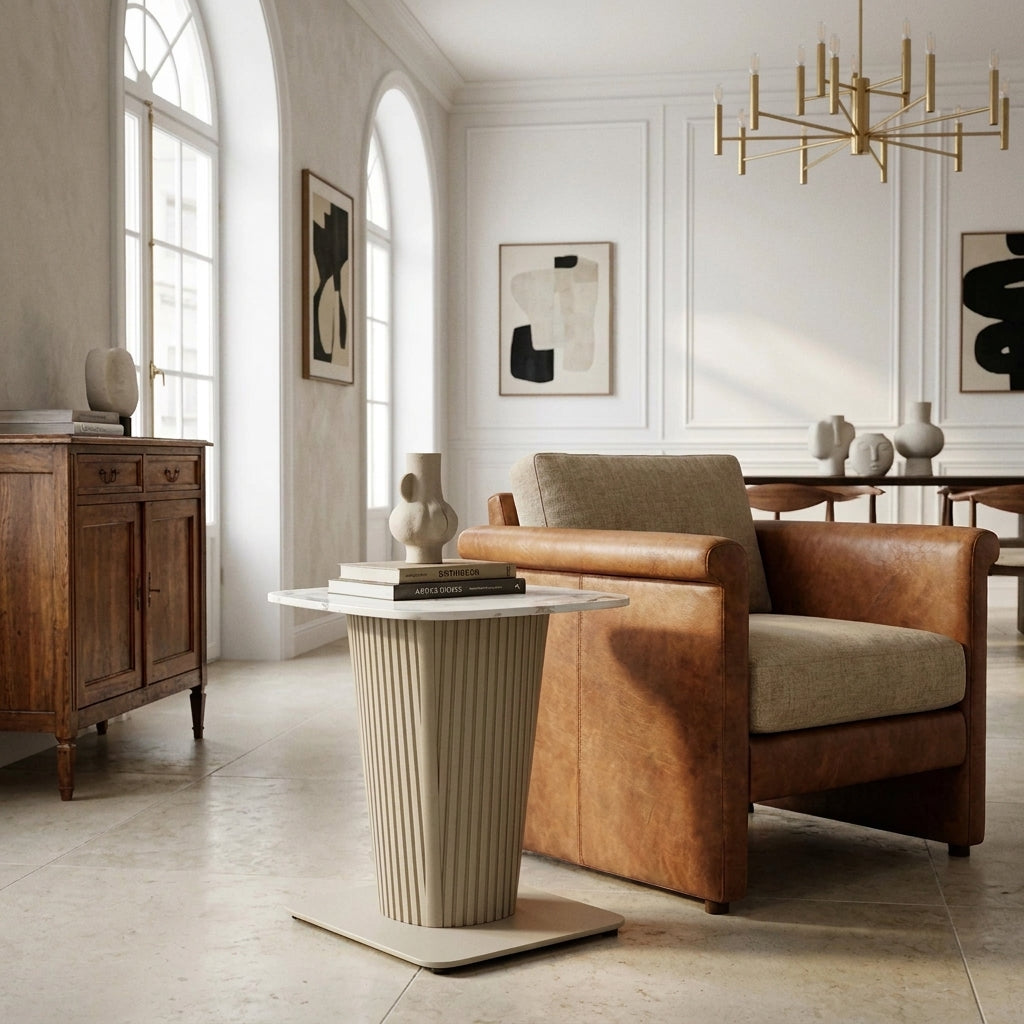 Castello Lamp Table with white ceramic top and fluted taupe pedestal beside an armchair in a modern European living room