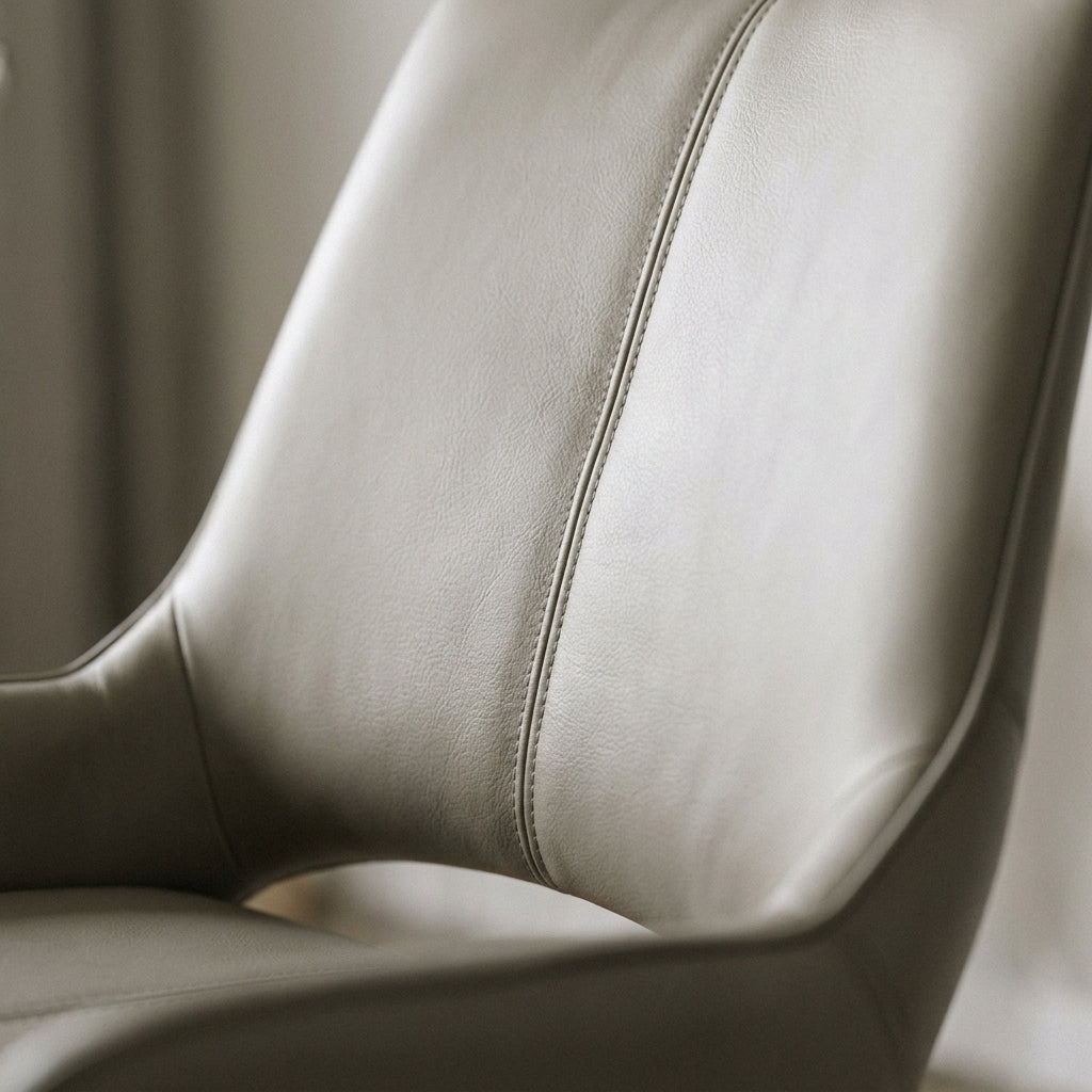 Close up of the greige upholstery and centre seam on a Castello dining chair