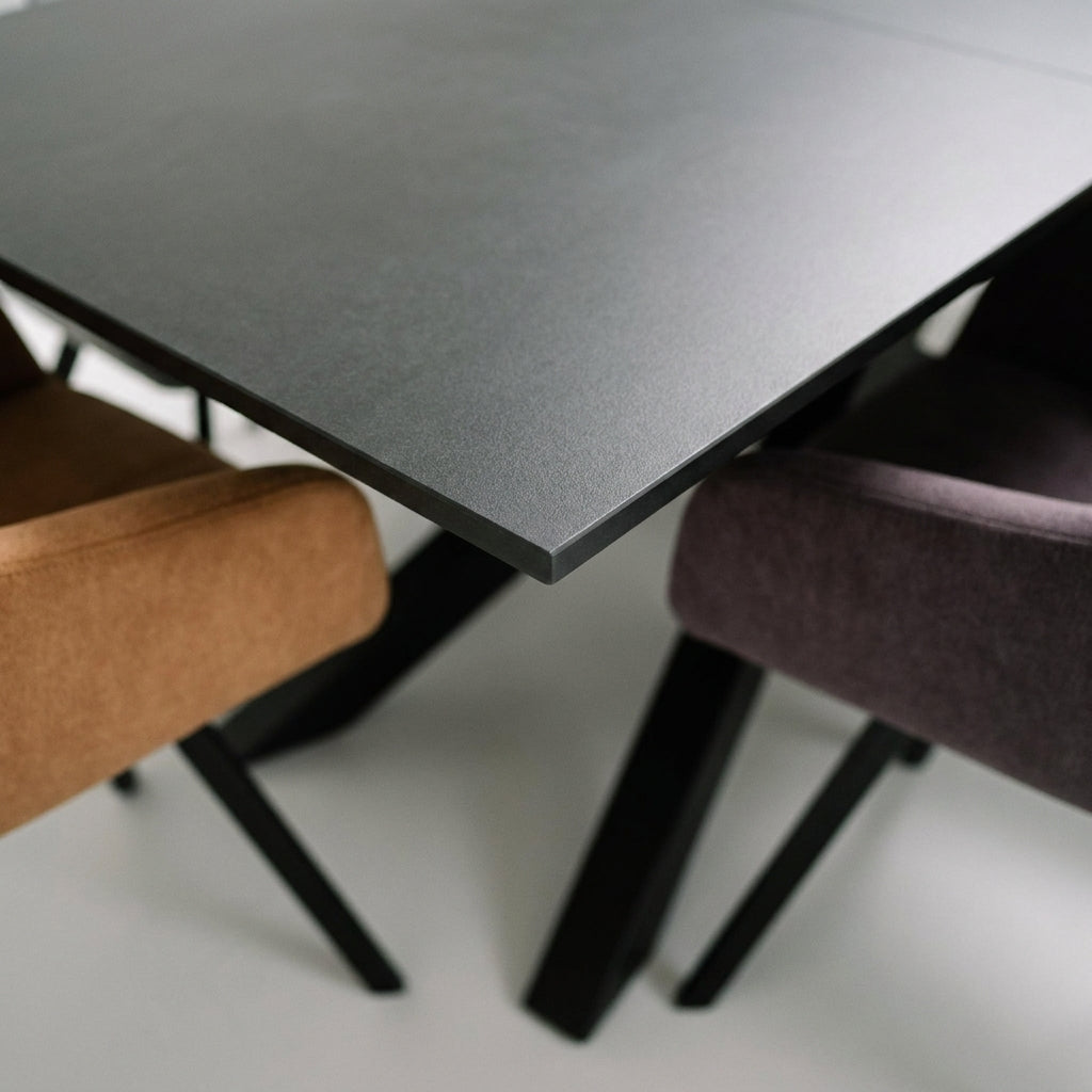 Close up of the corner and squared edge of the Manhattan charcoal sintered stone table top