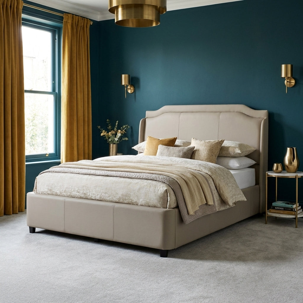 Murlough ottoman bedframe in a bedroom with deep teal walls and mustard velvet curtains