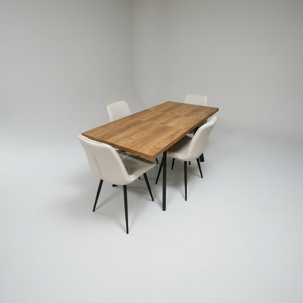 Sloan 5 Piece Extending Dining Set, oak effect extending table on black metal legs with four cream faux leather chairs, on a plain pale grey studio background