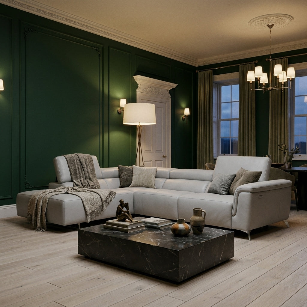 Kimi Corner Sofa in a period living room with deep forest green panelled walls and a pale oak floor, lit by evening lamplight