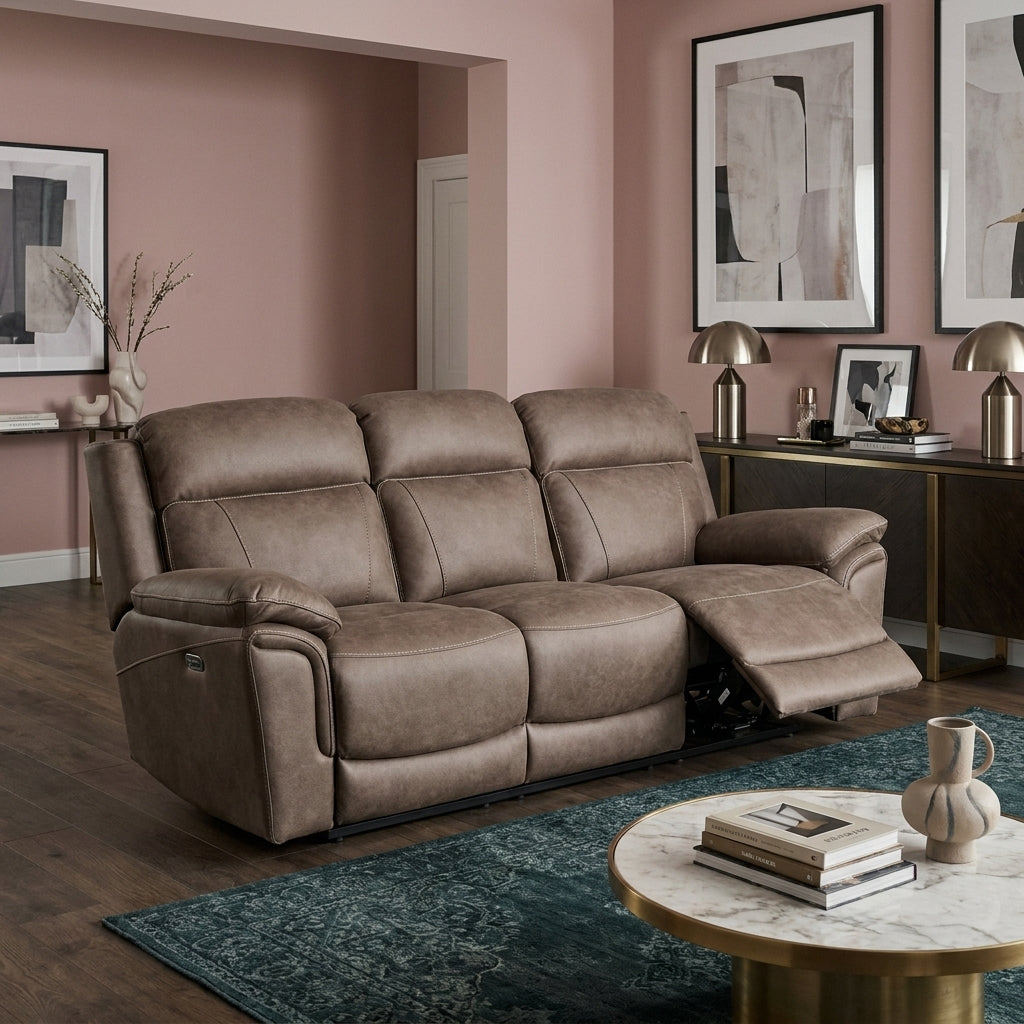 Alamo electric reclining sofa in a living room with dusky pink walls, dark boards and a deep teal patterned rug