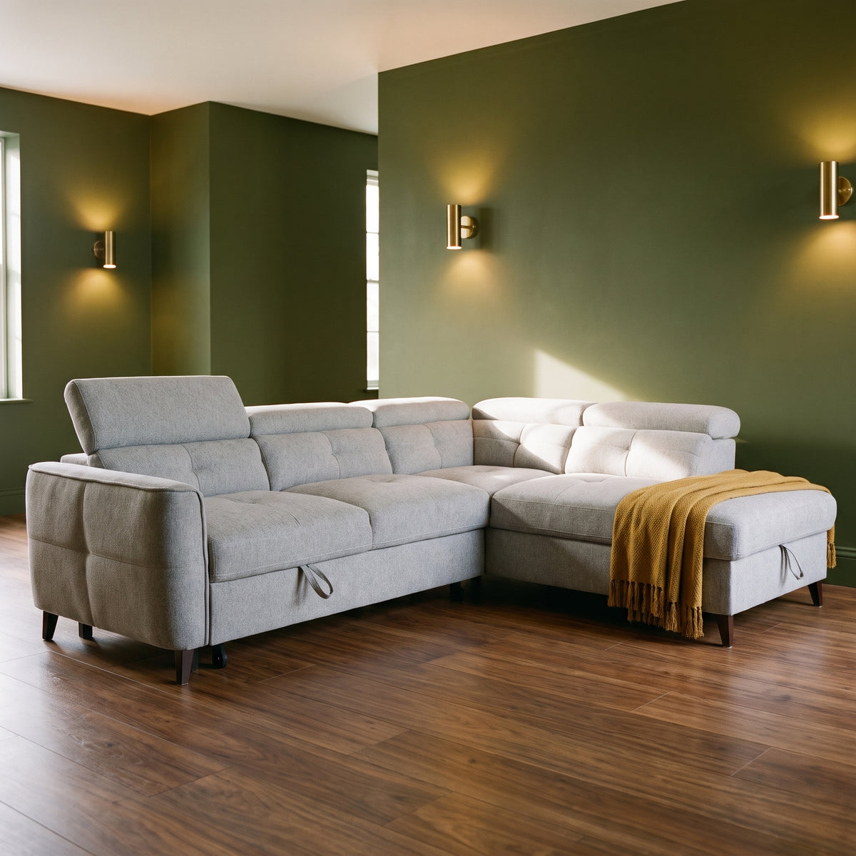 Nemo corner sofa bed in light grey fabric with storage chaise, in a room with deep olive green walls and walnut flooring