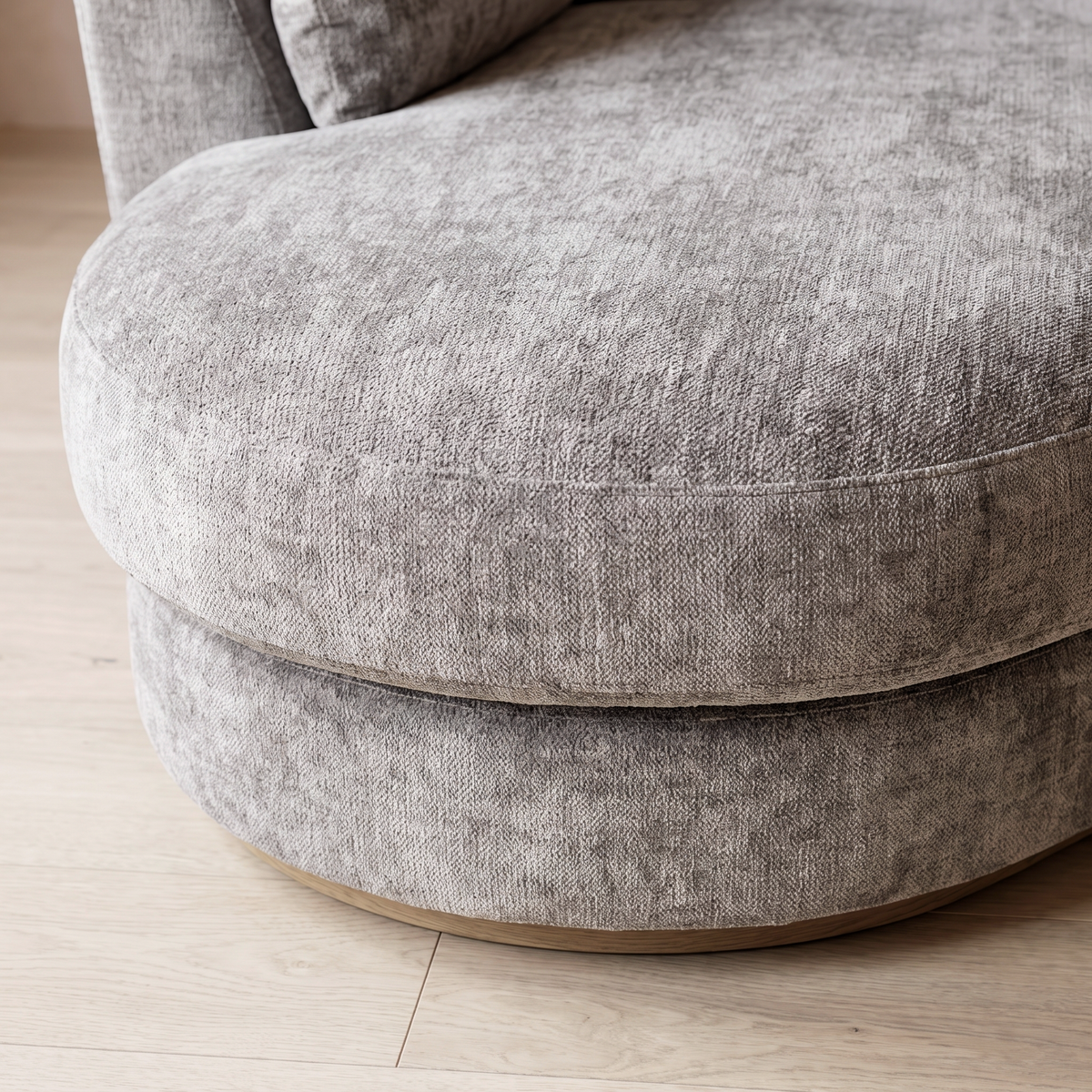 Close up of the rounded chaise end and grey chenille pile on the Persia curved sofa