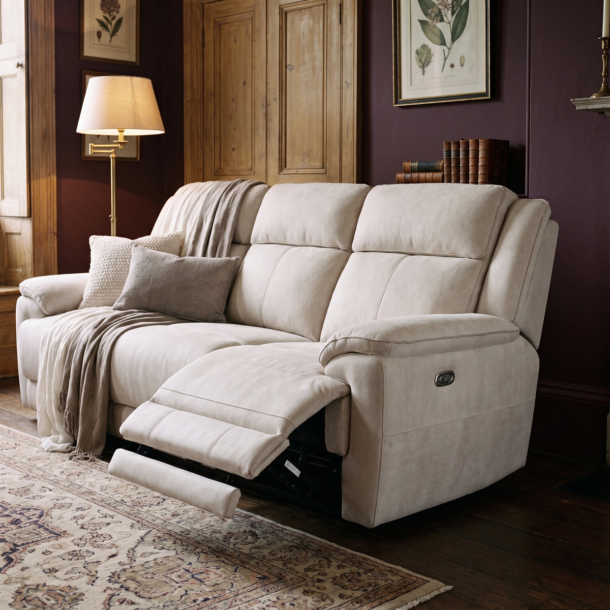 Walton sofa with one footrest extended, in a period room with deep plum walls and a patterned wool rug