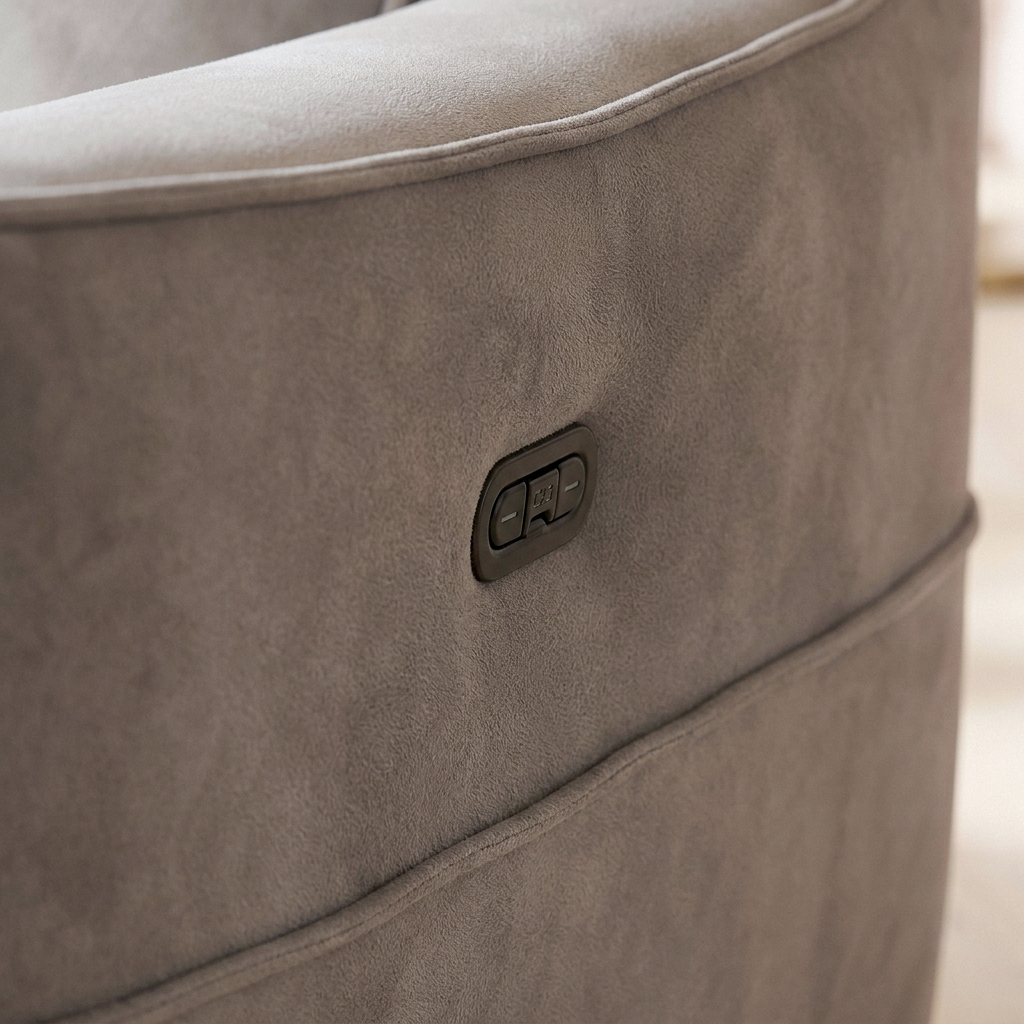 Close up of the recline control button and dove grey fabric on the Dune recliner