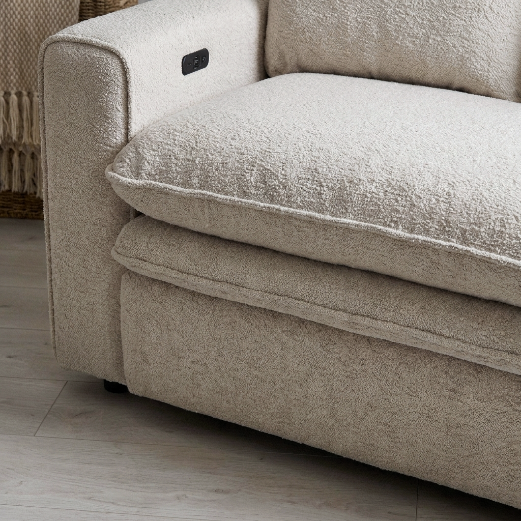 Close up of the piped seat edge and oatmeal boucle texture on the Arabella sofa bed