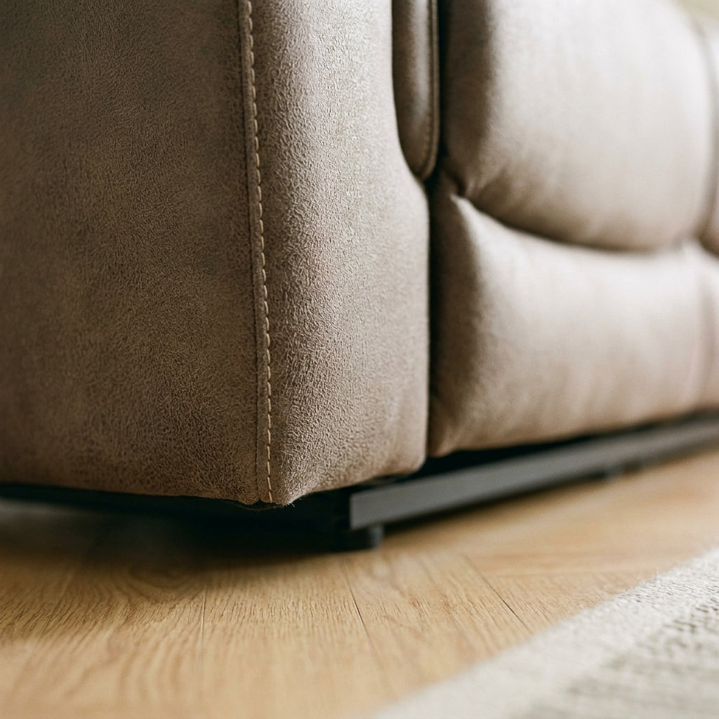Close up of the base corner and stitched seam on the Alamo reclining suite in walnut brown