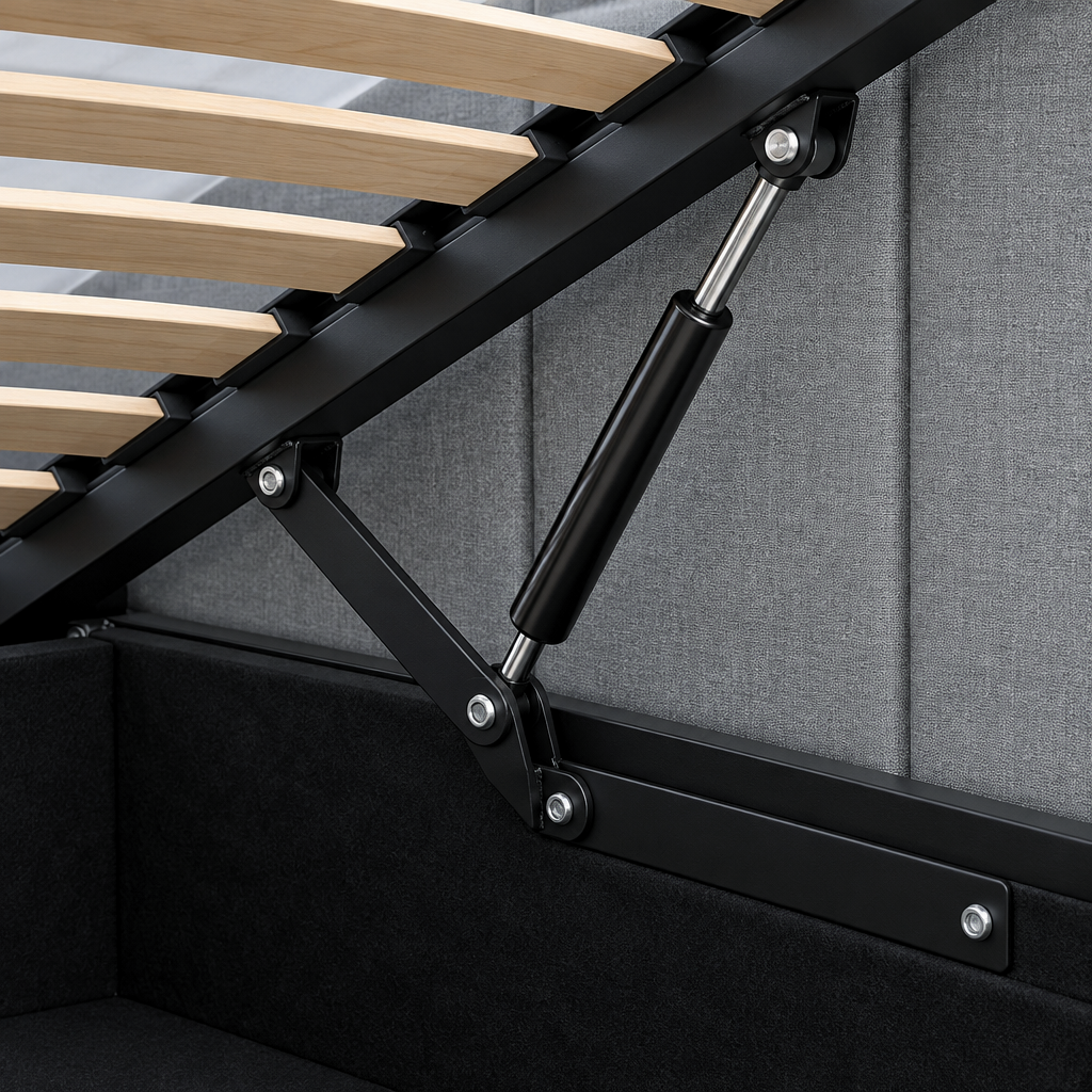Close-up of the Neptune ottoman bed lifting mechanism, showing the black gas strut and hinge linkage, wooden slatted base and lined storage well