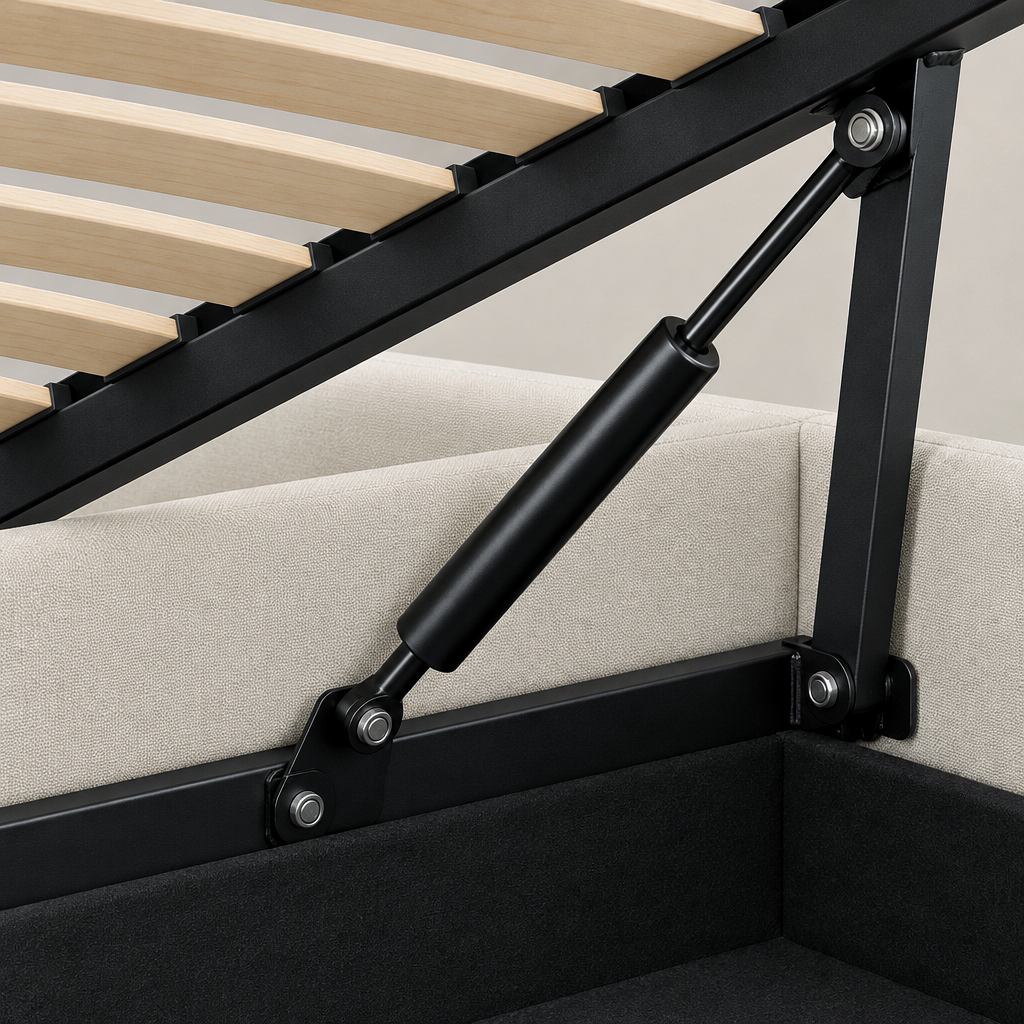 Close-up of the Murlough ottoman bed lifting mechanism, showing the black gas strut and hinge linkage, wooden slatted base and lined storage well
