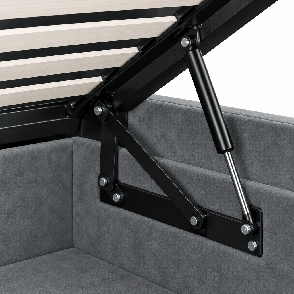 Close-up of the Luxor ottoman bedframe lifting mechanism, showing the black gas strut, slatted frame and lined storage well