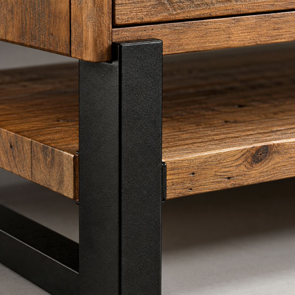 Close-up of the Jennifer coffee table black metal frame bracket carrying the antiqued pine lower shelf