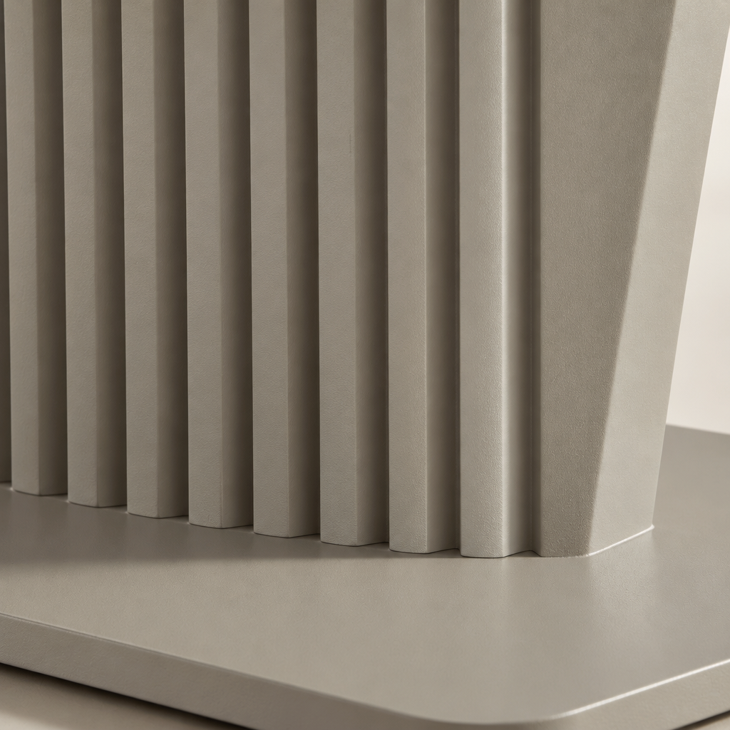 Close detail of the Castello Coffee Table's fluted taupe pedestal meeting its flat base plate