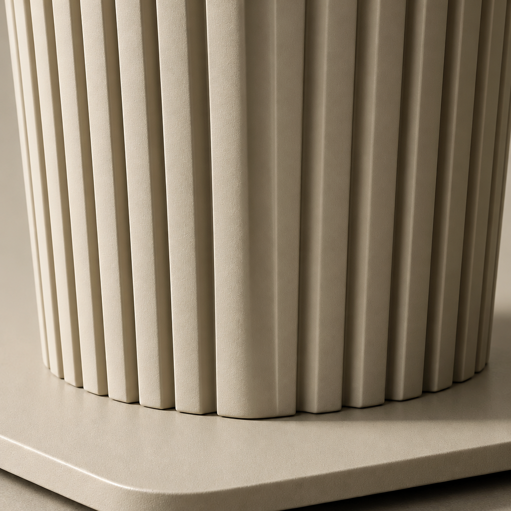 Close detail of the Castello Lamp Table's fluted taupe pedestal meeting its flat base plate